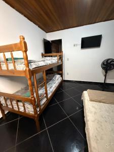 Ένα ή περισσότερα κρεβάτια σε δωμάτιο στο Brisas de arraial turismo e hospedagem