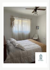 Postel nebo postele na pokoji v ubytování La Laguna Cruz del Eje + 12 fotografií