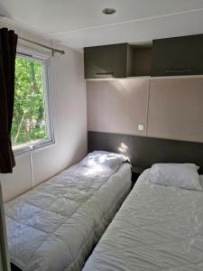 Postel nebo postele na pokoji v ubytování Mobil home Côte d'Opale