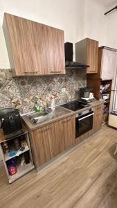 a kitchen with a sink and a stove top oven at San Siro rooms in Milan