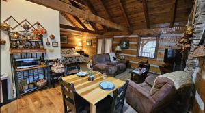 a large living room with a table and chairs at Bear View in Townsend
