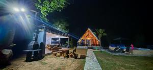 a house at night with a lit up at Emin Dom Mionica in Valjevo