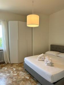 Postel nebo postele na pokoji v ubytování Hotel Monti