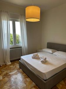 Postel nebo postele na pokoji v ubytování Hotel Monti