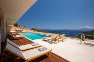 a villa with a swimming pool and views of the ocean at 2S Villas Resort - Cave Villas in Sivota +192 photos