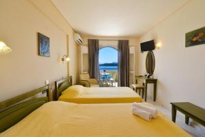 Postel nebo postele na pokoji v ubytování Hotel Niras + 37 fotografií