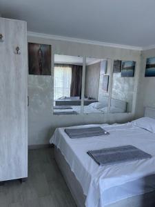 Postel nebo postele na pokoji v ubytování Ramgon