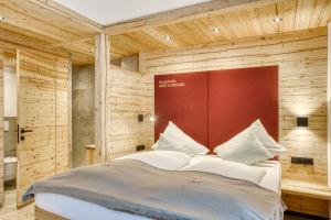 Posteľ alebo postele v izbe v ubytovaní Hotel Alpenstolz