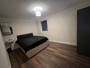 Ένα ή περισσότερα κρεβάτια σε δωμάτιο στο Atherley Rooms +6 φωτογραφίες