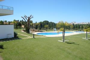 a view of a swimming pool in a park at Vila Branca in Mosqueira