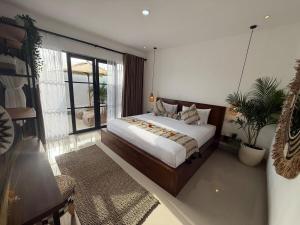 Postel nebo postele na pokoji v ubytování Bali Bird Villa Canggu
