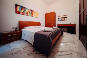 Rúm í herbergi á Rapture Gozo - Guesthouse