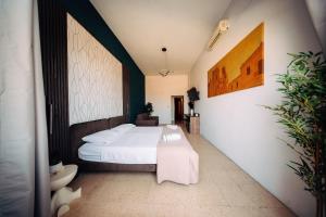 Rúm í herbergi á Rapture Gozo - Guesthouse