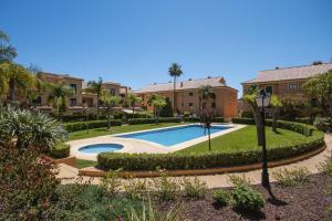 a villa with a swimming pool in a resort at Floridamar in Jávea
