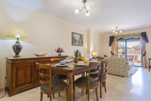 a kitchen and dining room with a table and chairs at Floridamar in Jávea