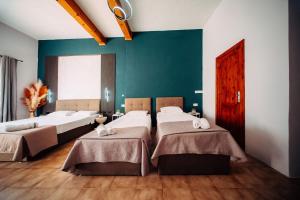 Rúm í herbergi á Rapture Gozo - Guesthouse