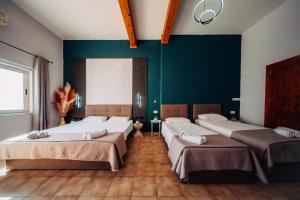 Rúm í herbergi á Rapture Gozo - Guesthouse