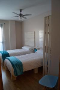 Cama o camas de una habitación en Apartamento Turístico “El Yugo”