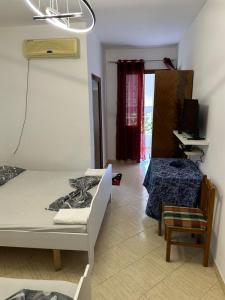Postel nebo postele na pokoji v ubytování Hotel Moris