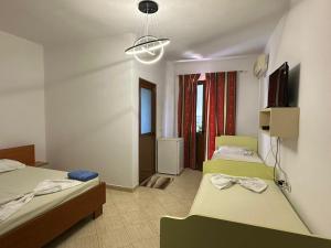 Postel nebo postele na pokoji v ubytování Hotel Moris