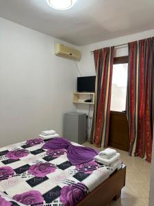 Postel nebo postele na pokoji v ubytování Hotel Moris
