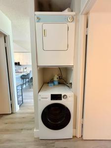 a washer and dryer in a small room at Chic Salt Lake 2-Bedroom FG condo in Honolulu