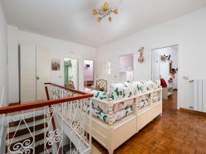 un salon avec un canapé et un escalier dans l'établissement Villa dei Fiori - Exclusive Villa with garden in Sorrento Coast, à Vico Equense