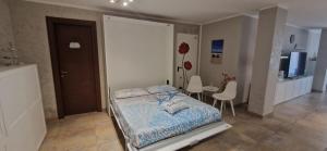 Ένα ή περισσότερα κρεβάτια σε δωμάτιο στο Una Perla per 2