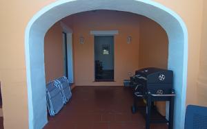 a hallway with an archway with a hair salon at Villa Blu splendida villa con piscina - Stintino Sardegna in Cuile Pazzoni +43 photos