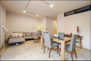 a living room with a table and a couch at Casa Mitho in Bogotá