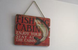 ein Schild, das Fischaugenkabine liest, genießen Sie Ihren Aufenthalt in der Hütte in der Unterkunft Studio Port Rhu Douarnenez in Douarnenez
