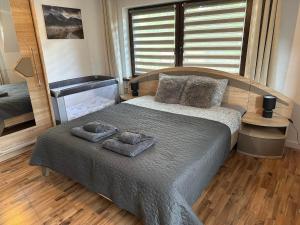 Postel nebo postele na pokoji v ubytování Apartament Hey Gron