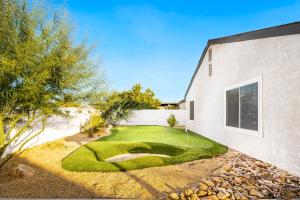 a miniature golf course in front of a building at Relaxing Getaway with Pool and Putting Green and BBQ in Indio