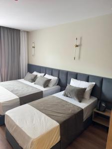 Postel nebo postele na pokoji v ubytování Vion Hotel