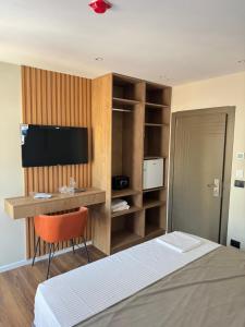 TV a/nebo společenská místnost v ubytování Vion Hotel + 37 fotografií
