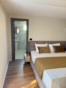 Postel nebo postele na pokoji v ubytování Vion Hotel