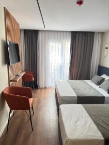 Postel nebo postele na pokoji v ubytování Vion Hotel