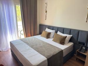 Postel nebo postele na pokoji v ubytování Vion Hotel