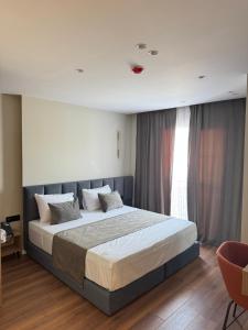 Postel nebo postele na pokoji v ubytování Vion Hotel