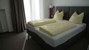 Postel nebo postele na pokoji v ubytování Hotel Sonnenbichl