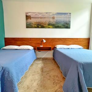 Postel nebo postele na pokoji v ubytování Gran Jaguar Hotel