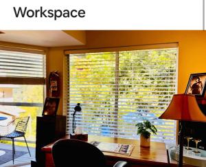 a room with a desk and a window with a workspace at Cliff House in West Vancouver
