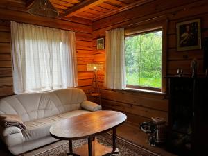 Posezení v ubytování Senovinis medinis namas - Gintaras