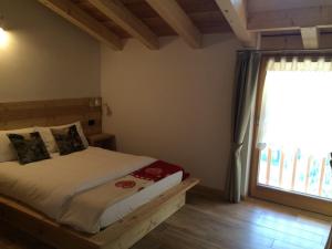 Ένα ή περισσότερα κρεβάτια σε δωμάτιο στο Agritur Maso Ciprianna B&B