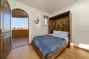 a bedroom with a bed and a large window at Bella Sirena 2BR 2BA 3rd Floor Ocean View B301 in Puerto Peñasco +50 photos