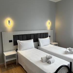 Postel nebo postele na pokoji v ubytování Hotel Garden