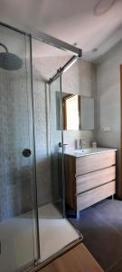 a bathroom with a shower and a sink at Casa Saballa in O Grove +14 photos