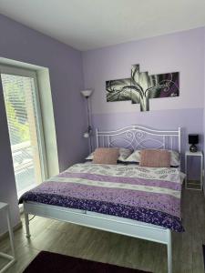 Postel nebo postele na pokoji v ubytování Apartmány Na Rozcestí