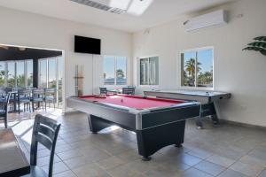 a living room with a pool table and tables at Las Palmas 2BR 2BA Suite Ground Floor- D101 in Campo del Medio