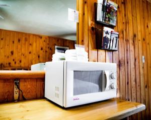 a microwave sitting on top of a table at Big Horn Lodge in Moab